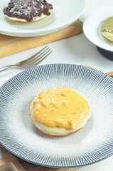 Serabi with cheese pasta topping, a traditional Indonesian snack.