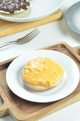 Serabi with cheese pasta topping, a traditional Indonesian snack.