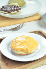 Serabi with cheese pasta topping, a traditional Indonesian snack.