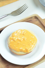 Serabi with cheese pasta topping, a traditional Indonesian snack.