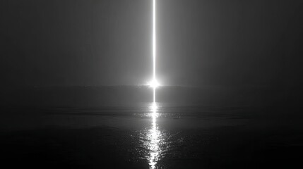 Sunrise beam over misty water