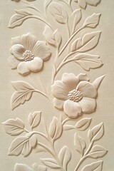 Cream-colored embossed floral design, repeating pattern