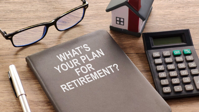Close-up of question "What's Your Plan For Retirement?" Word on Calendar with Calculator and Glasses