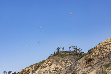 Paraglider flying high over Torrey Pines San Diego California 2025