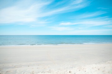 Tranquil Beach Scene with Turquoise Ocean and White Sand