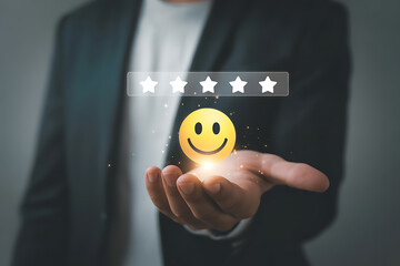 Hand holding glowing happy face emoji with five stars above image