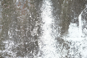 Weathered and cracked concrete wall, displaying age and texture. backgrounds or urban themes