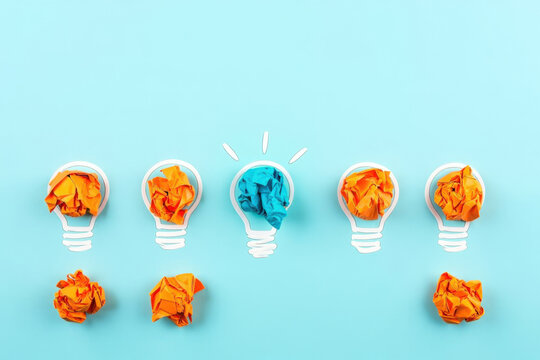 Unleashing Creativity and Innovation A Conceptual Image of Lightbulbs Filled with Crumpled Paper Representing the Process of Generating Ideas and Finding Unique Solutions - Powered by Adobe