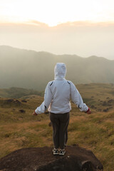 Lifestyle traveler happy feeling good relax and freedom facing in the sunrise morning. Travel Concept