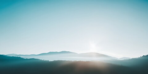 Fototapeta premium Misty mountain range bathed in soft light