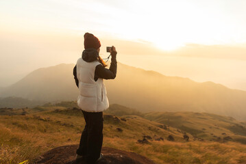 Lifestyle traveler happy feeling good relax and freedom facing in the sunrise morning. Travel Concept