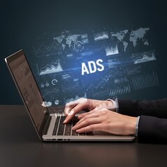 Typing on Laptop with ADS Projection Online Advertising and Marketing Concept