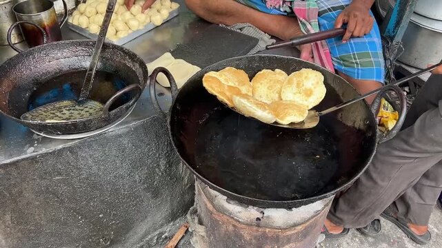 Kachori or puri being fried in hot oil in the streets of Kolkata
