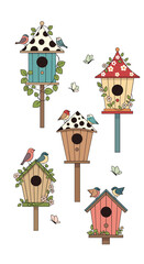 Charming collection of whimsical birdhouses adorned with floral decorations and perched birds in a garden setting