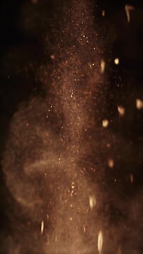 Cumin Seeds Cascading Down with Burst of Powder Against Black Background A Dynamic Culinary Shot Highlighting Spice Ingredients in Motion
