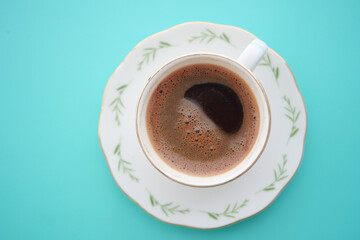 Freshly brewed coffee in delicate porcelain cup