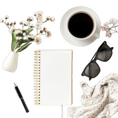 Flat lay of a coffee cup, notebook, flowers, sunglasses, and other accessories