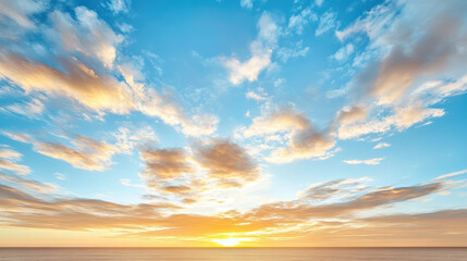 Fototapeta premium Vibrant sunset sky with colorful clouds reflecting on ocean surface, creating serene atmosphere