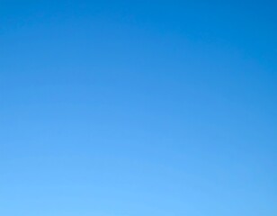 Clear, vibrant blue sky; minimal cloud coverage