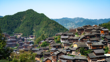 Ancient Chinese Wooden Village nestled in Mountains