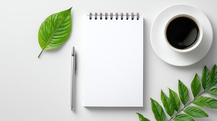 Minimalist office table layout from top view, notebook and pen aligned, fresh green leaf and coffee cup on side, large white space for design or quote insertion
