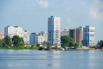 Fototapeta premium View of the North Korean cityscape of Sinuiju from a Yalu River cruise ship, Dandong, Liaoning, China