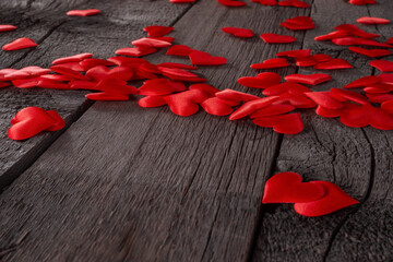 Red Fabric Hearts Scattered on Rustic Wooden Plank Background