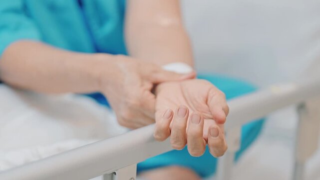 Elderly Patient  Woman having wrist pain in hospital, muscle ache due to Carpal Tunnel Syndrome, De Quervain s tenosynovitis, rheumatoid, arthritis, gout, Parkinson disease and ergonomic healthcare
