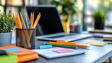 Creative workplace with laptop and supplies for enhanced productivity