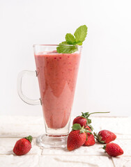 A glass of fresh strawberry juice with an enticing red color and smooth texture. Enjoy its natural sweet and sour freshness, perfect for quenching your thirst!