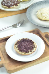 Serabi pancake with chocolate sprinkles topping, a traditional Indonesian snack.