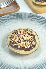 Serabi pancakes with chocolate and peanut butter toppings, a traditional Indonesian snack