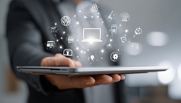 Businessperson holding tablet with digital icons