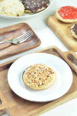 Serabi pancake with peanut topping and condensed milk, a traditional Indonesian snack