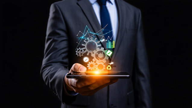 Businessman holding phone with digital gears and charts image