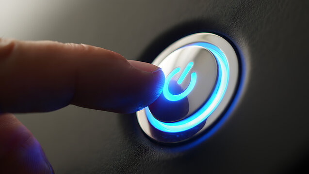 Finger pressing glowing power button technology blue light