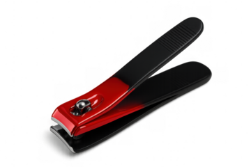 Nail clipper with red and black handles isolated on transparent background, useful tool for manicure and pedicure