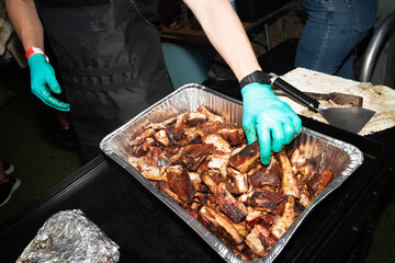 CHef prepares ribs outdoors