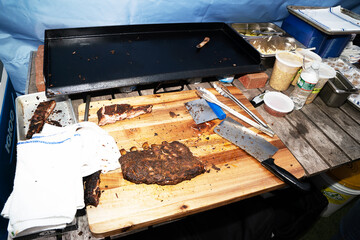 Rack of ribs being prepared outdoors