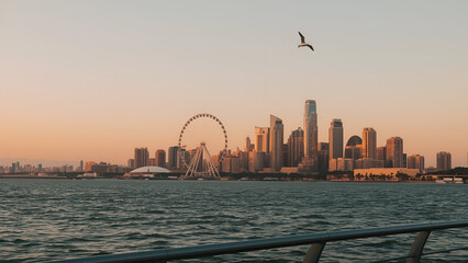 Modern City Skyline with Ferris Wheel at Sunset by the Waterfront