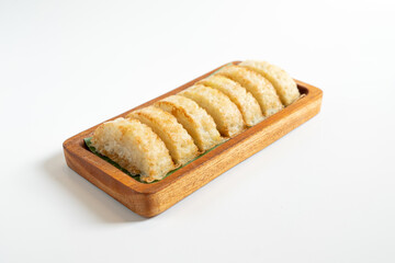 Kue Pancong, Gandos or Bandros is Indonesian traditional snack. This cake is a traditional food from the Betawi people. It is made from a mixture of rice flour, grated coconut, sugar, and coconut milk