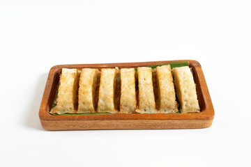 Kue Pancong, Gandos or Bandros is Indonesian traditional snack. This cake is a traditional food from the Betawi people. It is made from a mixture of rice flour, grated coconut, sugar, and coconut milk