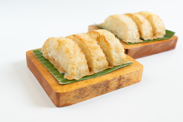 Kue Pancong, Gandos or Bandros is Indonesian traditional snack. This cake is a traditional food from the Betawi people. It is made from a mixture of rice flour, grated coconut, sugar, and coconut milk