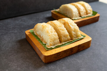 Kue Pancong, Gandos or Bandros is Indonesian traditional snack. This cake is a traditional food from the Betawi people. It is made from a mixture of rice flour, grated coconut, sugar, and coconut milk