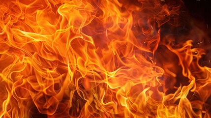 Bright orange and yellow flames with dynamic, swirling patterns create an intense and vivid fire image.