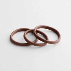 Naklejka premium Three stacked, light brown silicone rings