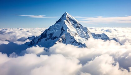 Snow-capped peak rises above a sea of clouds under a vibrant blue sky