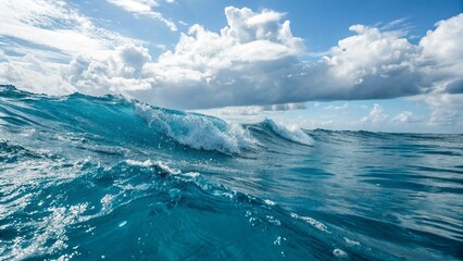 Fototapeta premium Ocean Wave, Turquoise Water, Bright Sunny Sky, Dramatic Cloudscape, Serene Seascape, Summer Vacation, Tropical Paradise, High-Resolution Stock Photo.