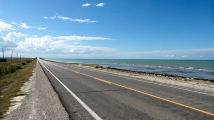 Coastal Highway: Serene Ocean Drive, Sunny Day, Asphalt Road, Blue Sky, Vacation Travel