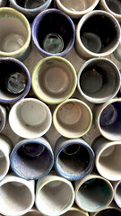 Top view of an array of colorful, empty ceramic pots